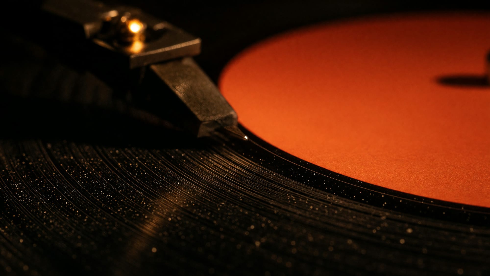 A tonearm lifted just clear of the run-out groove at the end of a side