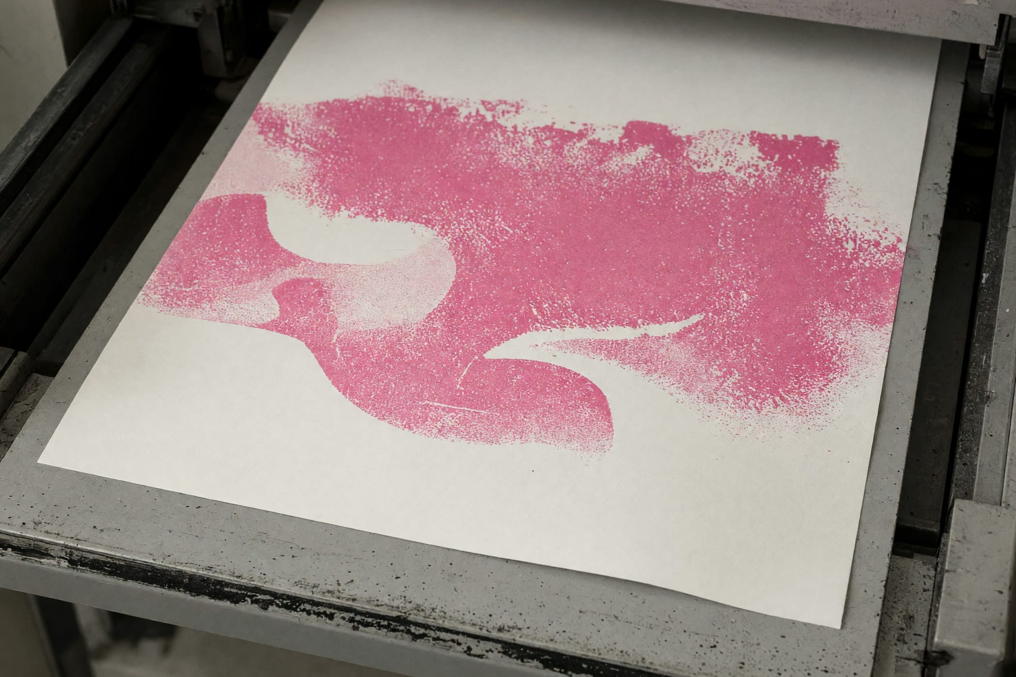 A sheet in the catch tray with only the first colour laid down