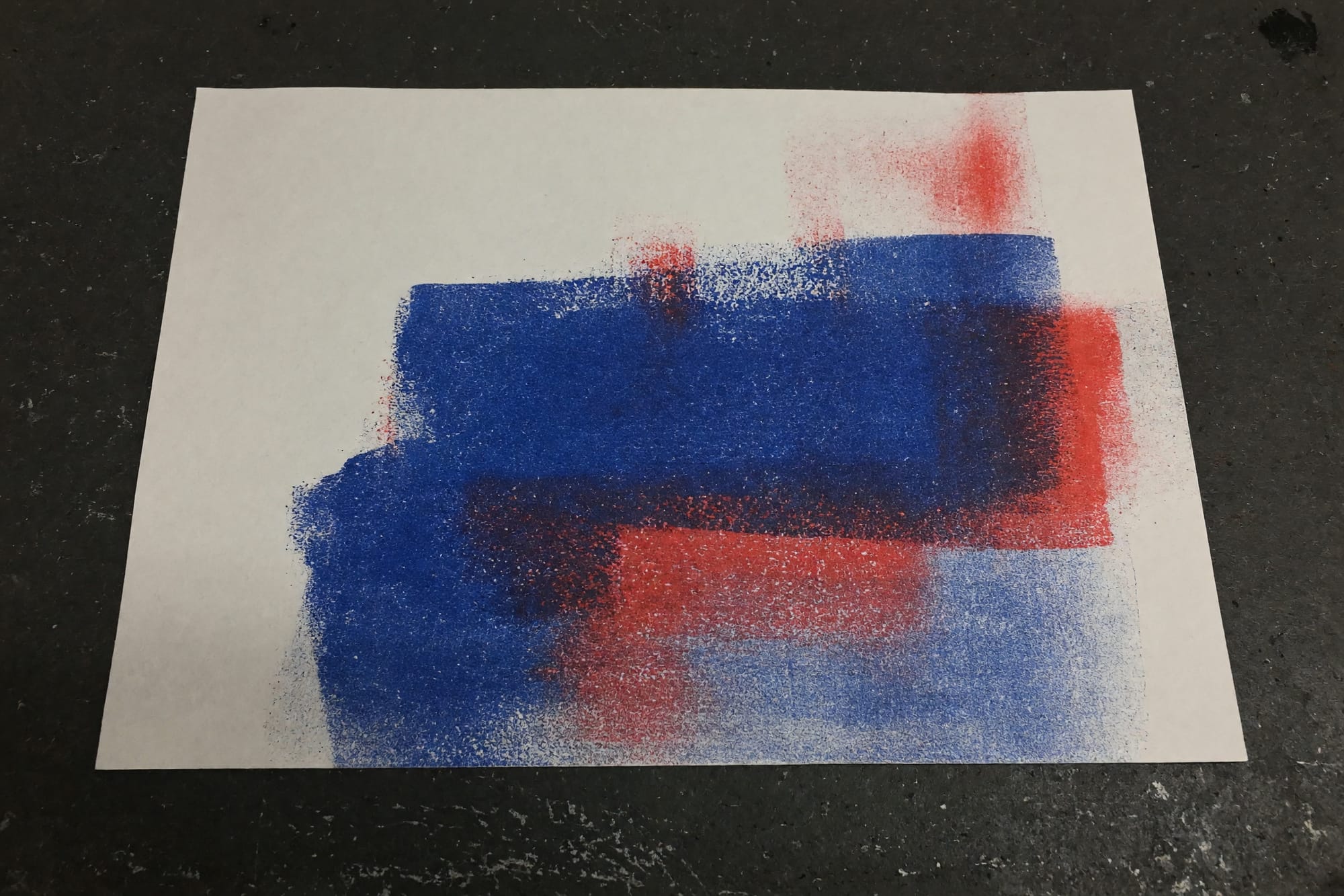 The same sheet after the second pass, with the blue slightly out of register